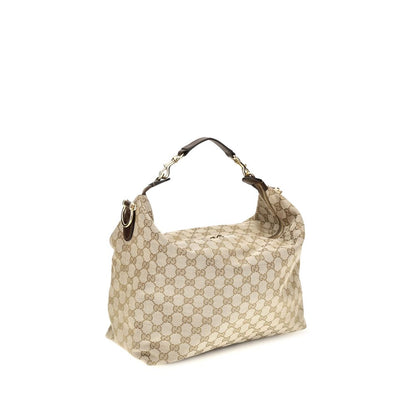 Medium Shoulder Bag by Gucci for men in nylon leather & canvas beige & gold features a effortless chic silhouette with a secure zipper, ample , and versatile shoulder-strap, adjustable-strap, detachable-strap & handle for a effortless chic finish.