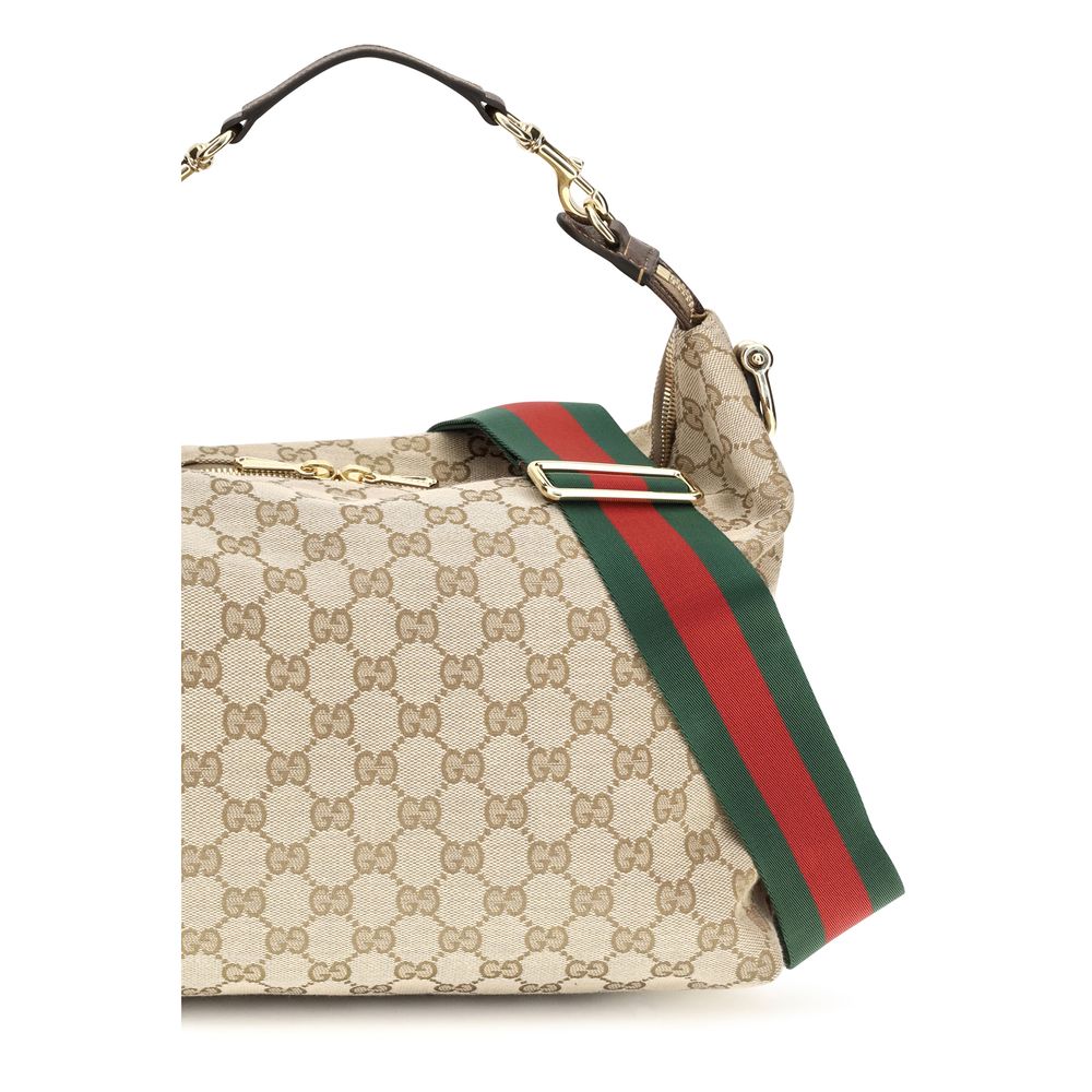 Medium Shoulder Bag by Gucci for men in nylon leather & canvas beige & gold features a effortless sophistication silhouette, secured by a zipper with ample and versatile shoulder-strap, adjustable-strap, detachable-strap & handle for a effortless sophistication finish.