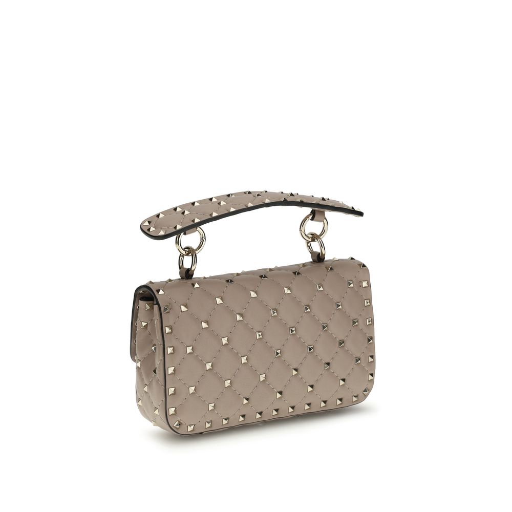 Small Shoulder Handbag by Valentino Garavani for women in bos taurus calf leather pink features a signature silhouette, showcasing a secure and signature with versatile shoulder-strap for a sophisticated look.