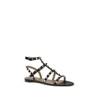 Flat Sandals by Valentino Garavani for women in bos taurus calf leather black features an effortlessly chic silhouette from the Rockstud Women's Bos Taurus Calf Leather Flat Sandals collection, showcasing a effortlessly chic flat and elegant .