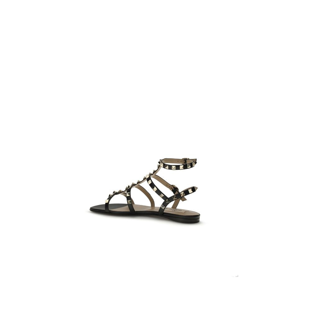 Flat Sandals by Valentino Garavani for women in bos taurus calf leather black features an architectural design from the Rockstud Women's Bos Taurus Calf Leather Flat Sandals collection, defined by a architectural flat and for a architectural finish.
