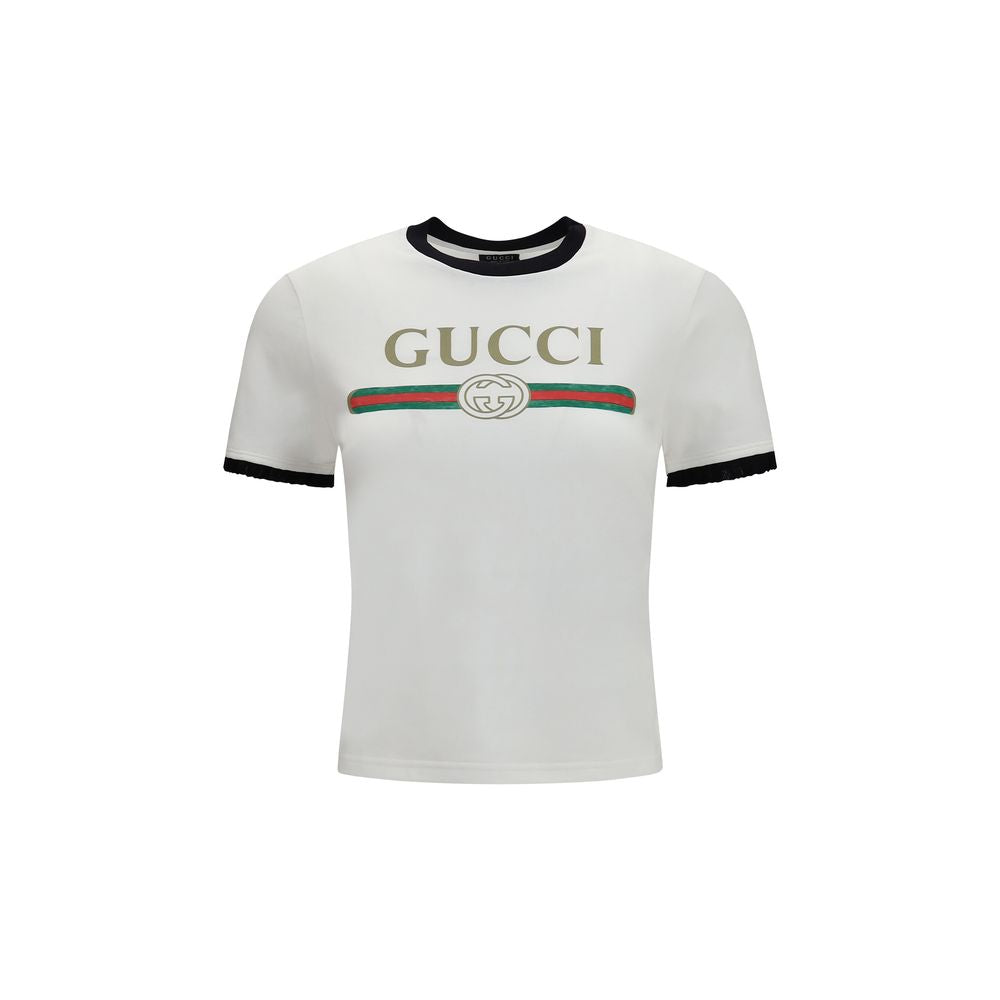 T-Shirt by Gucci for women in cotton white & print showcases a dramatic silhouette, elegantly detailed with a dramatic crew neckline and short-sleeve for a truly dramatic finish.