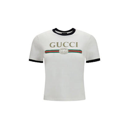 T-Shirt by Gucci for women in cotton white & print showcases a dramatic silhouette, elegantly detailed with a dramatic crew neckline and short-sleeve for a truly dramatic finish.