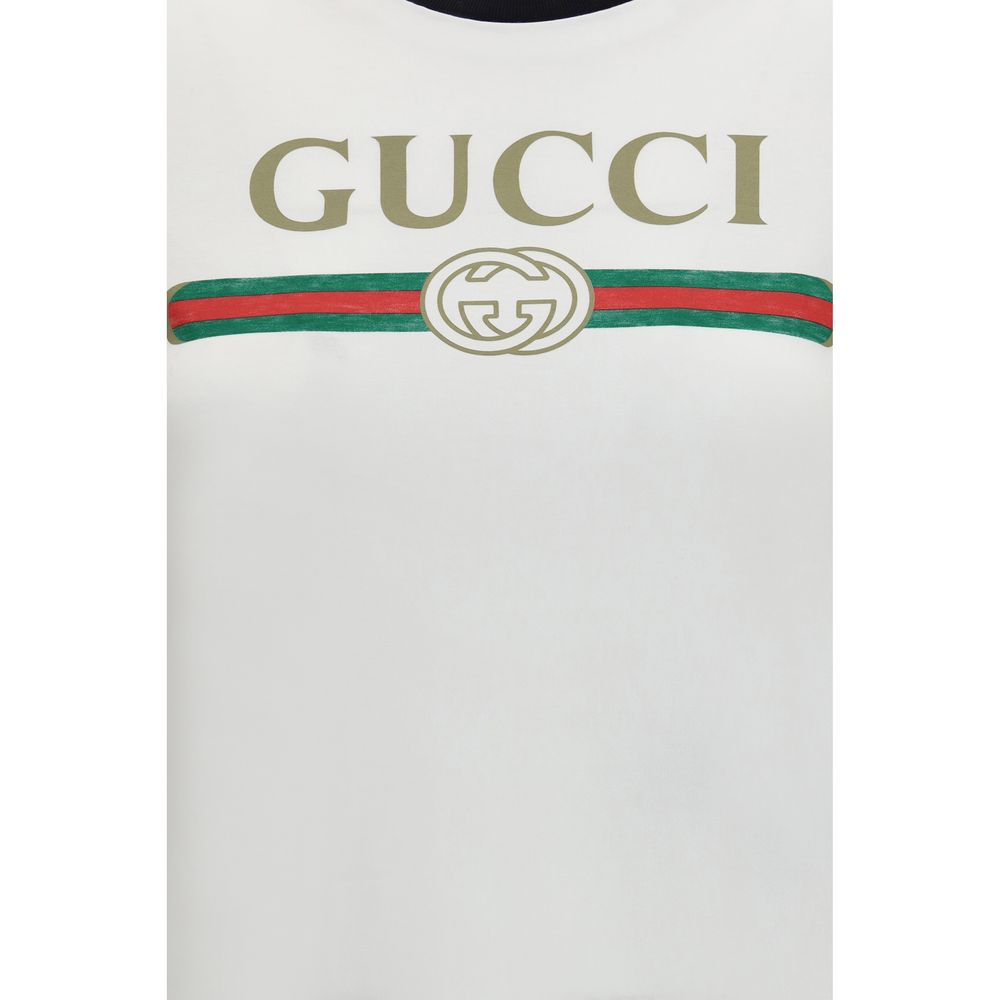 T-Shirt by Gucci for women in cotton white & print showcases a fashionable silhouette, elegantly detailed with a fashionable and for a sophisticated, high-fashion look.