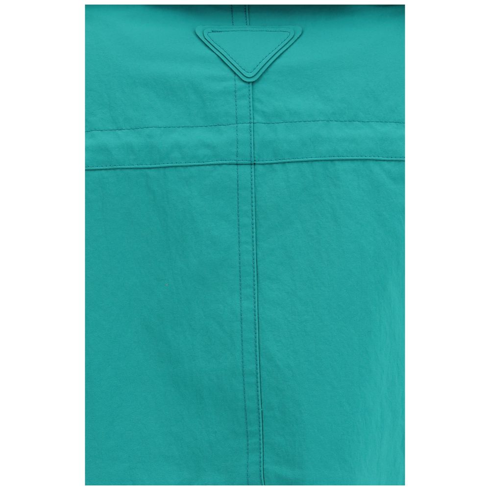 Hooded Cape by Prada for men in nylon fabric blue presents a cosy chic silhouette, meticulously detailed with distinctive pockets & hooded and a sophisticated for a truly cosy chic finish.