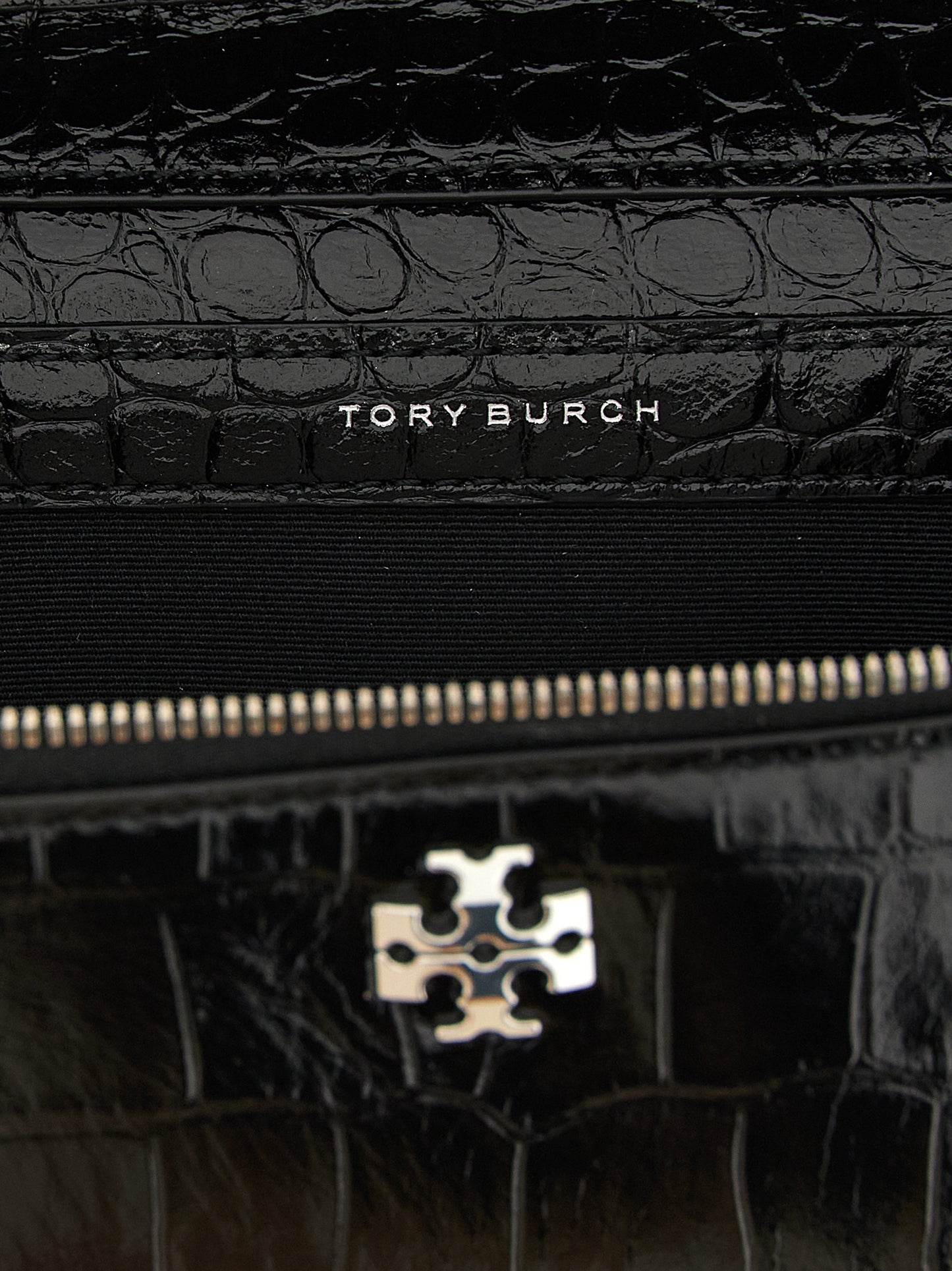 2-in-1 Shoulder & Crossbody East West Tote Handbag by Tory Burch for women in exotic skin leather black, silver & print features a multifaceted silhouette, showcasing a secure and multifaceted with versatile crossbody-strap, shoulder-strap, handle & detachable-strap for multifaceted style.