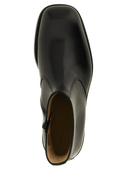 Ankle Boots by Lemaire for men in lamb leather black showcases a ergonomic silhouette from the Men's Lamb Leather Ankle Boots collection, featuring a ergonomic and a ergonomic square toe style.