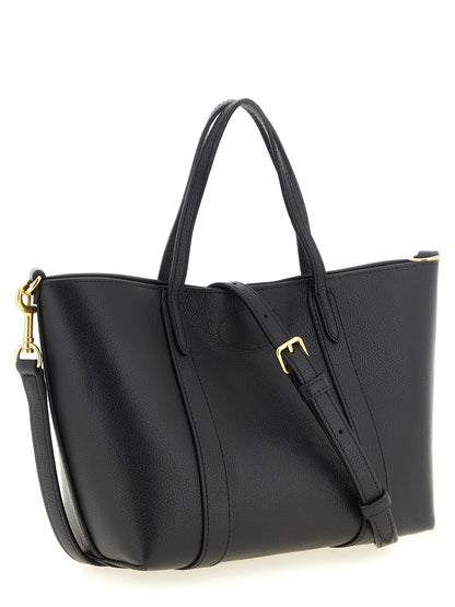 This Mni Tote Bag by Mulberry for women in calfskin leather black, gold & signature features an on trend Icon Calfskin Leather Mni Tote Bag design with a secure , ample , and on trend shoulder-strap, handle & adjustable-strap.