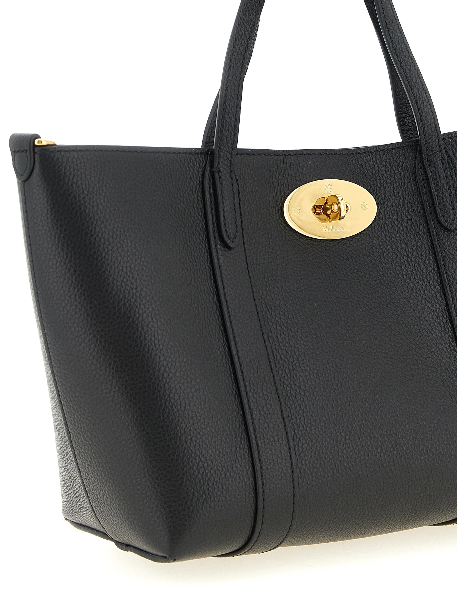 Mni Tote Bag by Mulberry for women in calfskin leather black, gold & signature features a distinguished Icon Calfskin Leather Mni Tote Bag design, complete with a secure , ample , and versatile shoulder-strap, handle & adjustable-strap for a distinguished look.