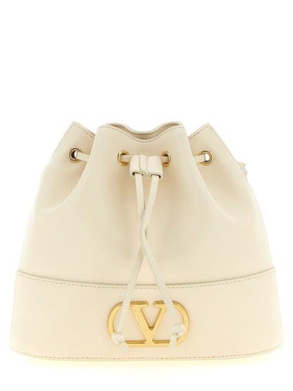Medium Crossbody Bucket Handbag by Valentino Garavani for women in lamb leather gold, white & signature features a transformative elegance silhouette, showcasing a secure drawstring & toggle, organized , and versatile crossbody-strap & shoulder-strap for a transformative elegance look.