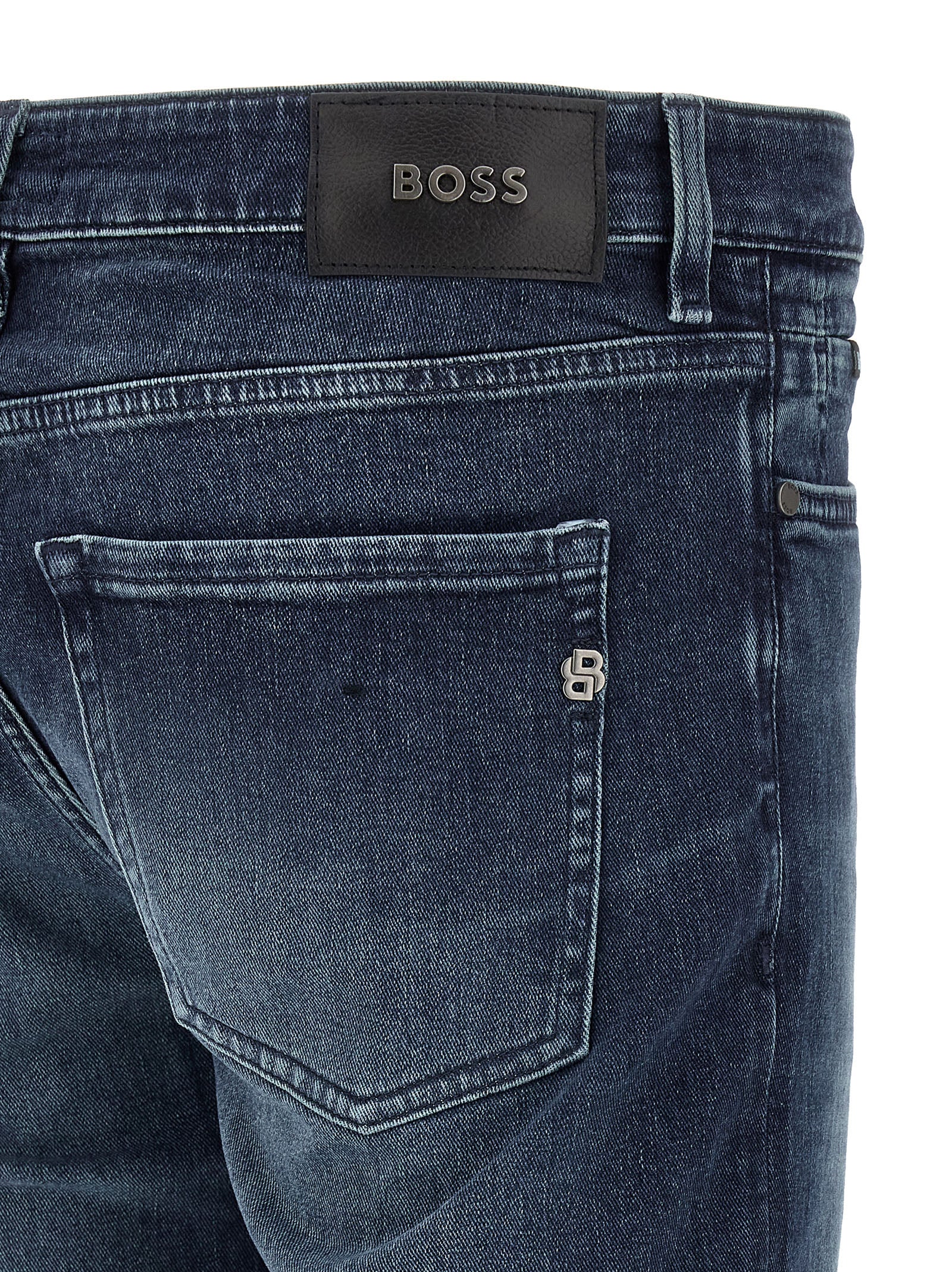 Jeans by Hugo Boss for men in stretch denim cotton dark-blue features an sartorial tapered-leg and long with a cut for a sartorial finish.