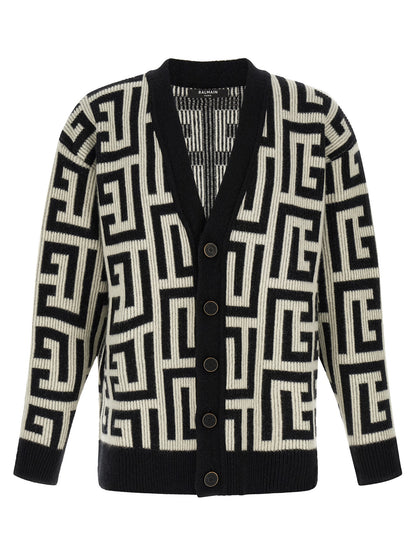 Cardigan by Balmain for men in cashmere merino wool & goat leather bicolour, black, white & monogram showcases a captivating silhouette, artfully detailed with a captivating and v-neck neckline for a truly sophisticated captivating look.