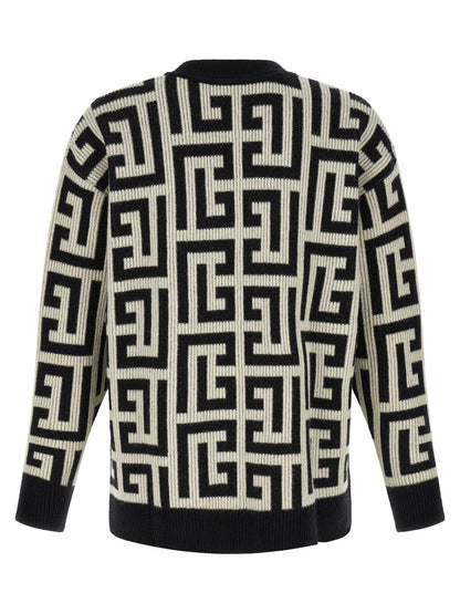 Cardigan by Balmain for men in cashmere merino wool & goat leather bicolour, black, white & monogram features a dramatic silhouette, showcasing a sophisticated v-neck neckline and dramatic detail for a timeless, premium look.