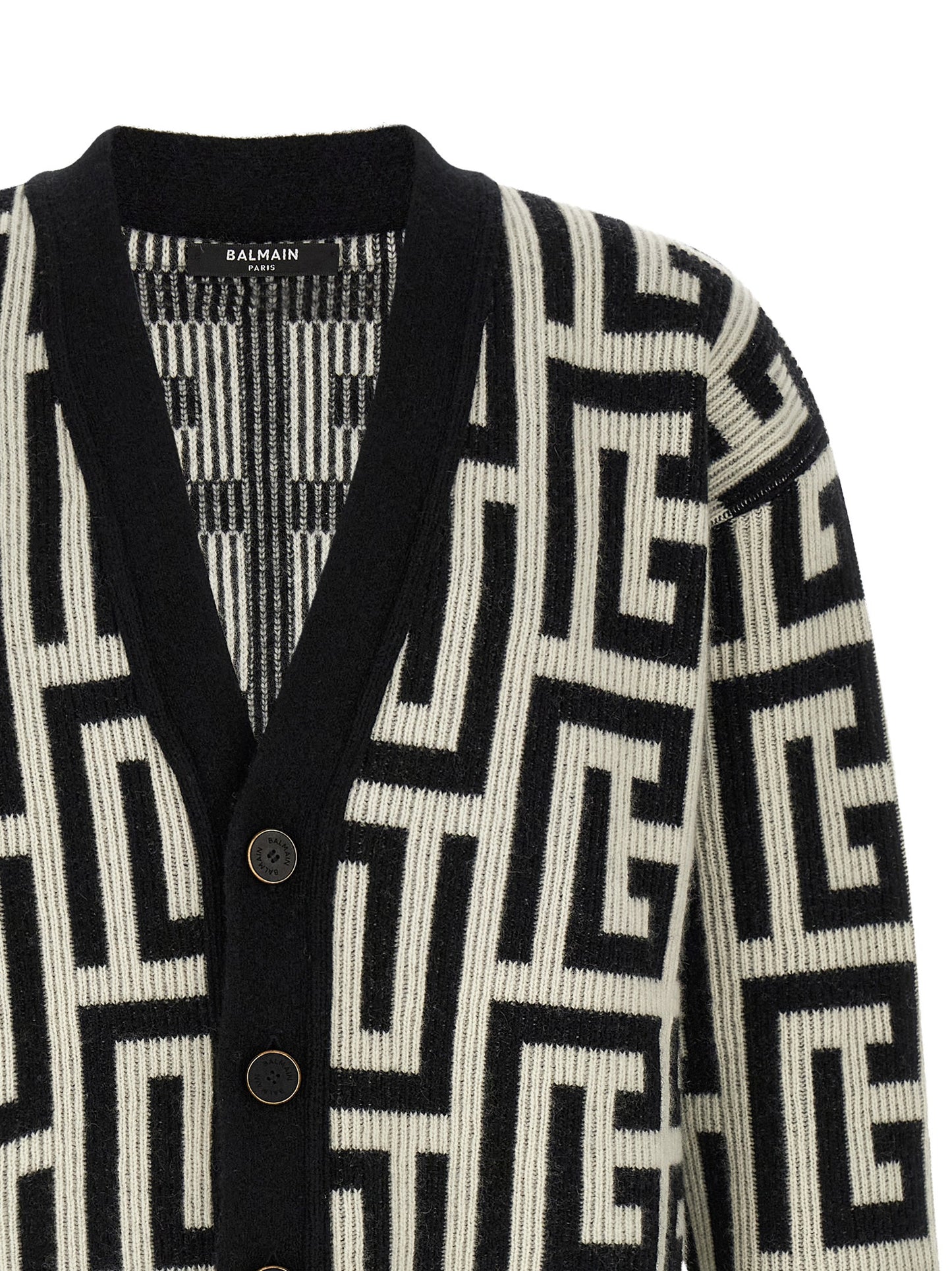 Cardigan by Balmain for men in cashmere merino wool & goat leather bicolour, black, white & monogram features an crisp silhouette, showcasing a sophisticated v-neck neckline and detail for a truly crisp finish.
