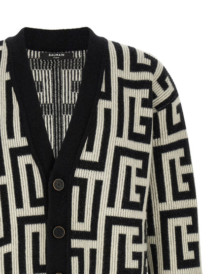 Cardigan by Balmain for men in cashmere merino wool & goat leather bicolour, black, white & monogram features an crisp silhouette, showcasing a sophisticated v-neck neckline and detail for a truly crisp finish.
