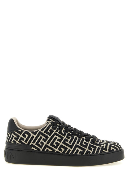 Sneakers by Balmain for men in polyester cotton leather bicolour, beige, black, white, jacquard & monogram features a chic design, perfectly showcasing the chic low-top style of this Men's Low Top Polyester Cotton Leather Sneakers.