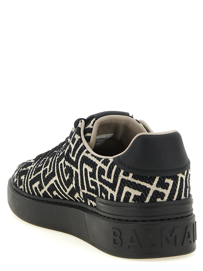 Sneakers by Balmain for men in polyester cotton leather bicolour, beige, black, white, jacquard & monogram presents a sumptuous silhouette, artfully capturing the essence of the Men's Low Top Polyester Cotton Leather Sneakers with its sumptuous low-top style design.