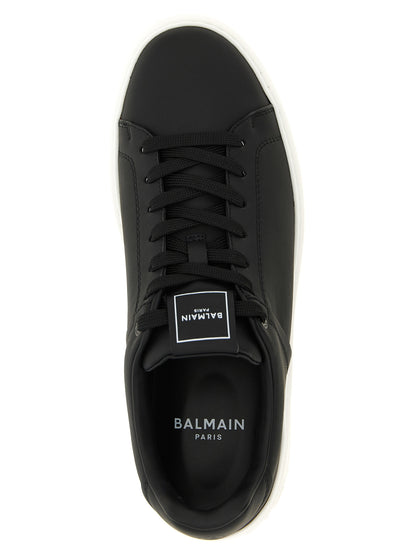 Sneakers by Balmain for men in calfskin leather bicolour, black & white features an fashionable silhouette, showcasing the premium Men's Low Top Calfskin Leather Sneakers in a fashionable low-top style that offers a fashionable finish for refined style.