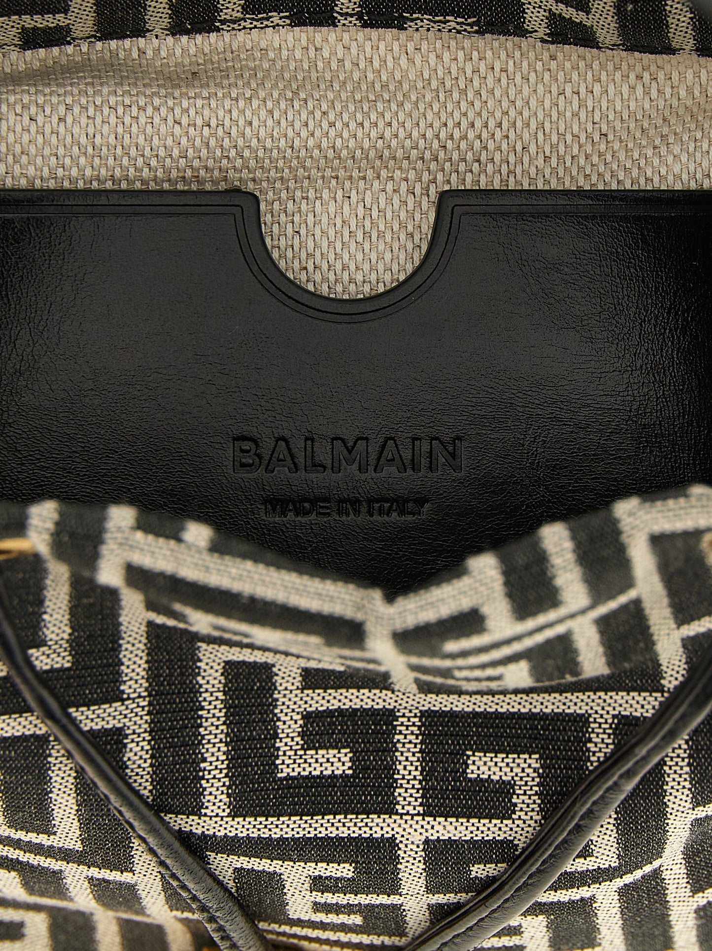 Mini Bucket Handbag by Balmain for women in leather & polyester cotton bicolour, black, gold, white, jacquard & monogram features a signature silhouette, showcasing a secure and signature with versatile adjustable-strap for a sophisticated look.