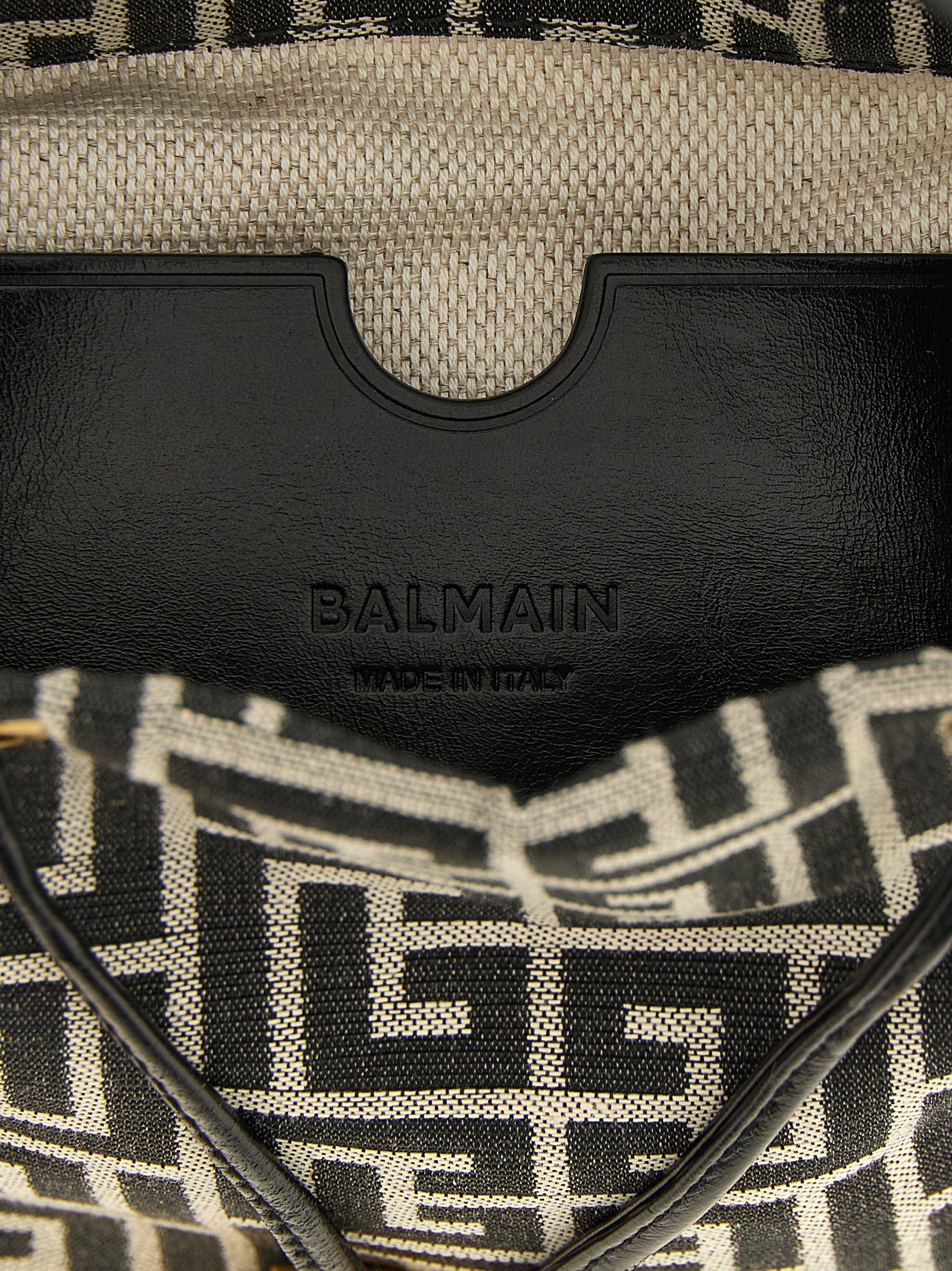 Mini Bucket Handbag by Balmain for women in leather & polyester cotton bicolour, black, gold, white, jacquard & monogram features a signature silhouette, showcasing a secure and signature with versatile adjustable-strap for a sophisticated look.