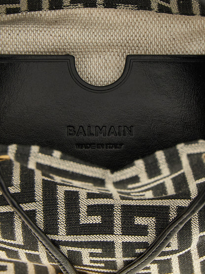 Mini Bucket Handbag by Balmain for women in leather & polyester cotton bicolour, black, gold, white, jacquard & monogram features a signature silhouette, showcasing a secure and signature with versatile adjustable-strap for a sophisticated look.