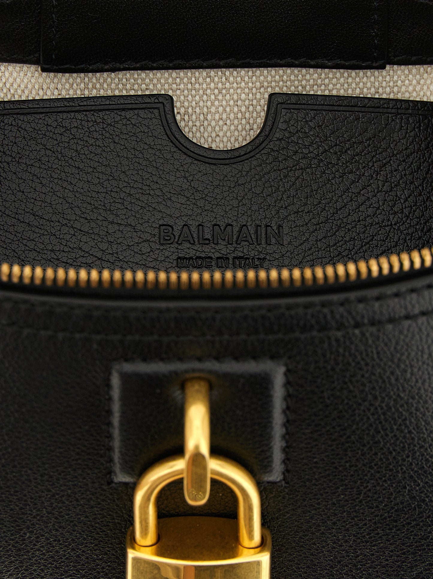 Vanity Handbag by Balmain for women in buffalo leather black & gold features a contemporary silhouette, showcasing a secure , ample cardholder, and contemporary shoulder-strap, handle & adjustable-strap for a sophisticated look.