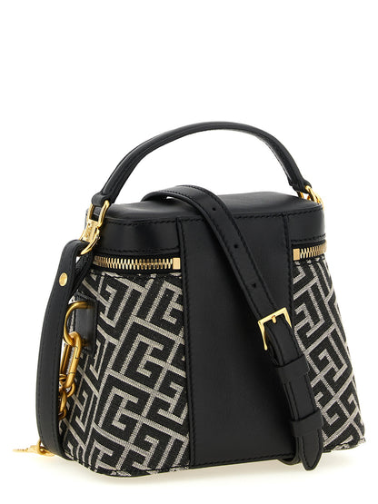 Vanity Handbag by Balmain for women in poly cotton canvas & leather bicolour, black, gold, ivory, white, jacquard & monogram features a contemporary silhouette, showcasing a secure zipper, ample , and contemporary for a sophisticated look.