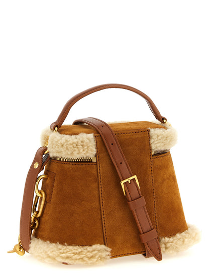 Vanity Handbag by Balmain for women in plush suede calfskin leather brown & gold features an refined silhouette, showcasing a secure zipper, ample , and versatile shoulder-strap & handle for a sophisticated refined aesthetic.