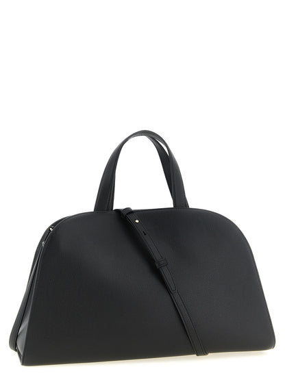 Crossbody Handbag by Tory Burch for women in bos taurus cowhide leather black & gold features a transformative sophistication silhouette, showcasing a secure snap, hook & button, ample , and versatile crossbody-strap, shoulder-strap, handle, adjustable-strap & belt-strap for a transformative sophistication look.