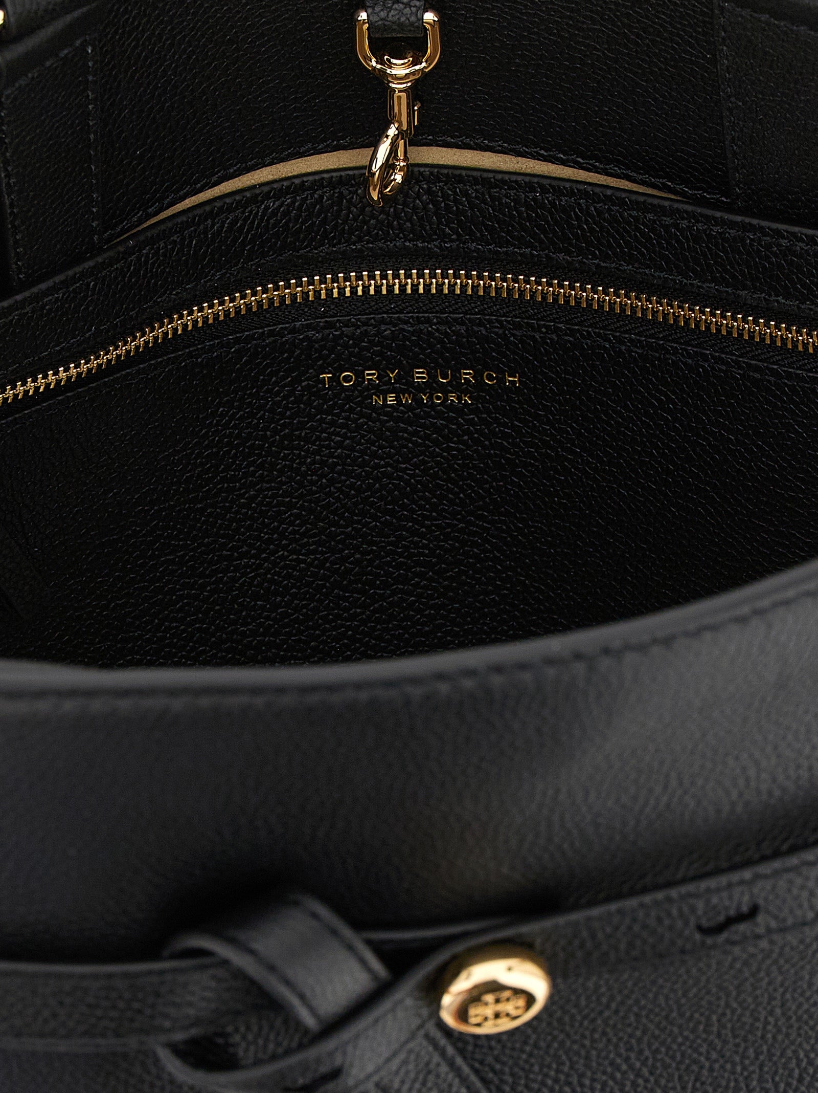 Crossbody Handbag by Tory Burch for women in bos taurus cowhide leather black & gold features an multi-faceted design with a secure snap, hook & button, ample , and versatile crossbody-strap, shoulder-strap, handle, adjustable-strap & belt-strap for a multi-faceted finish.