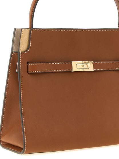 Small Crossbody Handbag by Tory Burch for women in bos taurus suede cowhide leather brown & gold features a transformative elegance silhouette, showcasing a secure , organized , and versatile crossbody-strap, handle & adjustable-strap for a transformative elegance look.