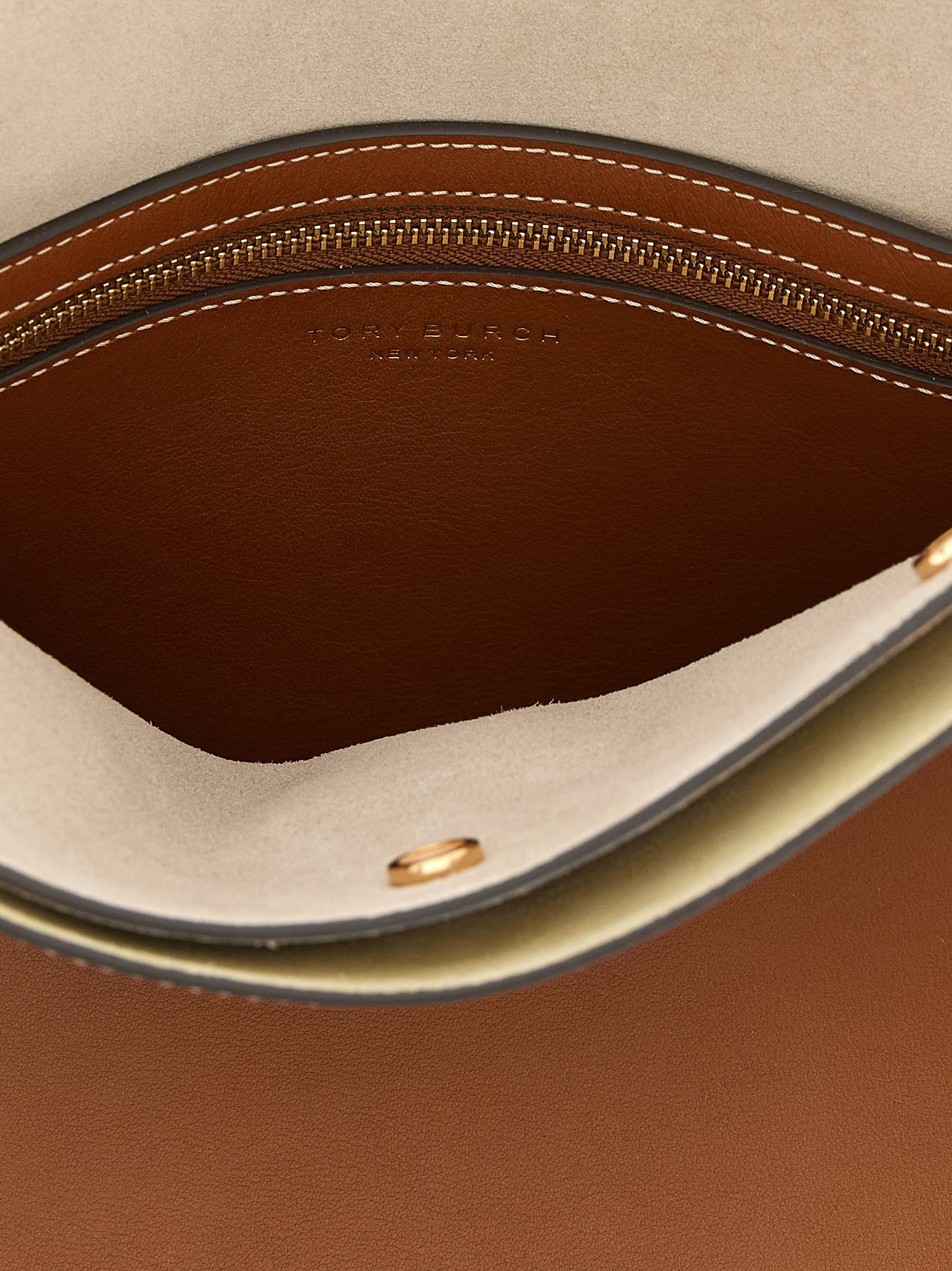 Small Crossbody Handbag by Tory Burch for women in bos taurus suede cowhide leather brown & gold features a multifaceted silhouette, showcasing a secure and multifaceted with versatile crossbody-strap, handle & adjustable-strap for multifaceted style.