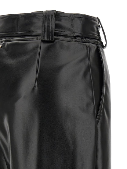 Trousers by Twinset for women in polyester leather black features a tailored silhouette with a tailored cropped, defined by its cropped and a sophisticated high rise.