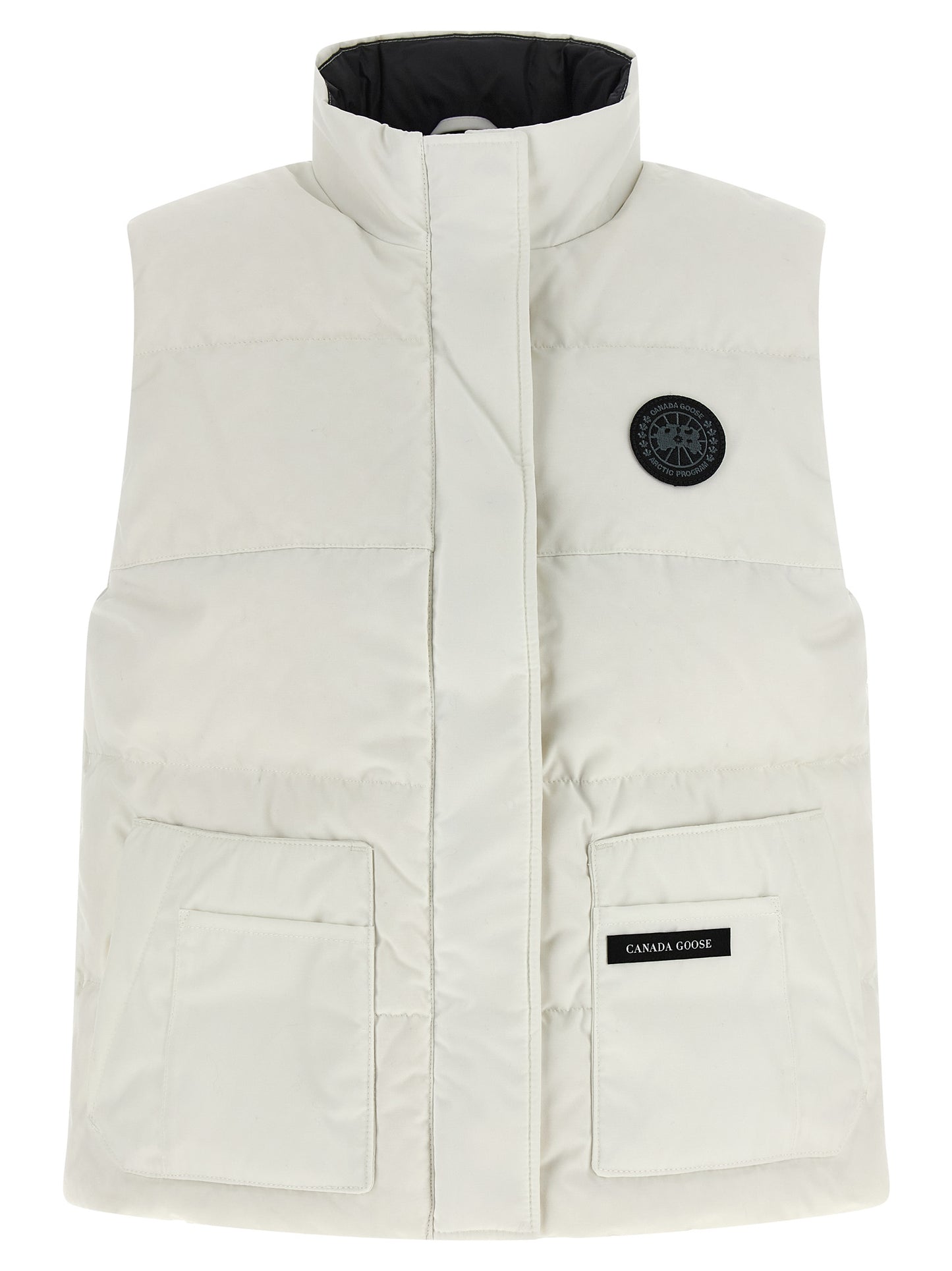 Vest by Canada Goose for women in cotton polyester black & white showcases a utilitarian silhouette, artfully incorporating pockets and a utilitarian high-neck neckline for a truly utilitarian finish.