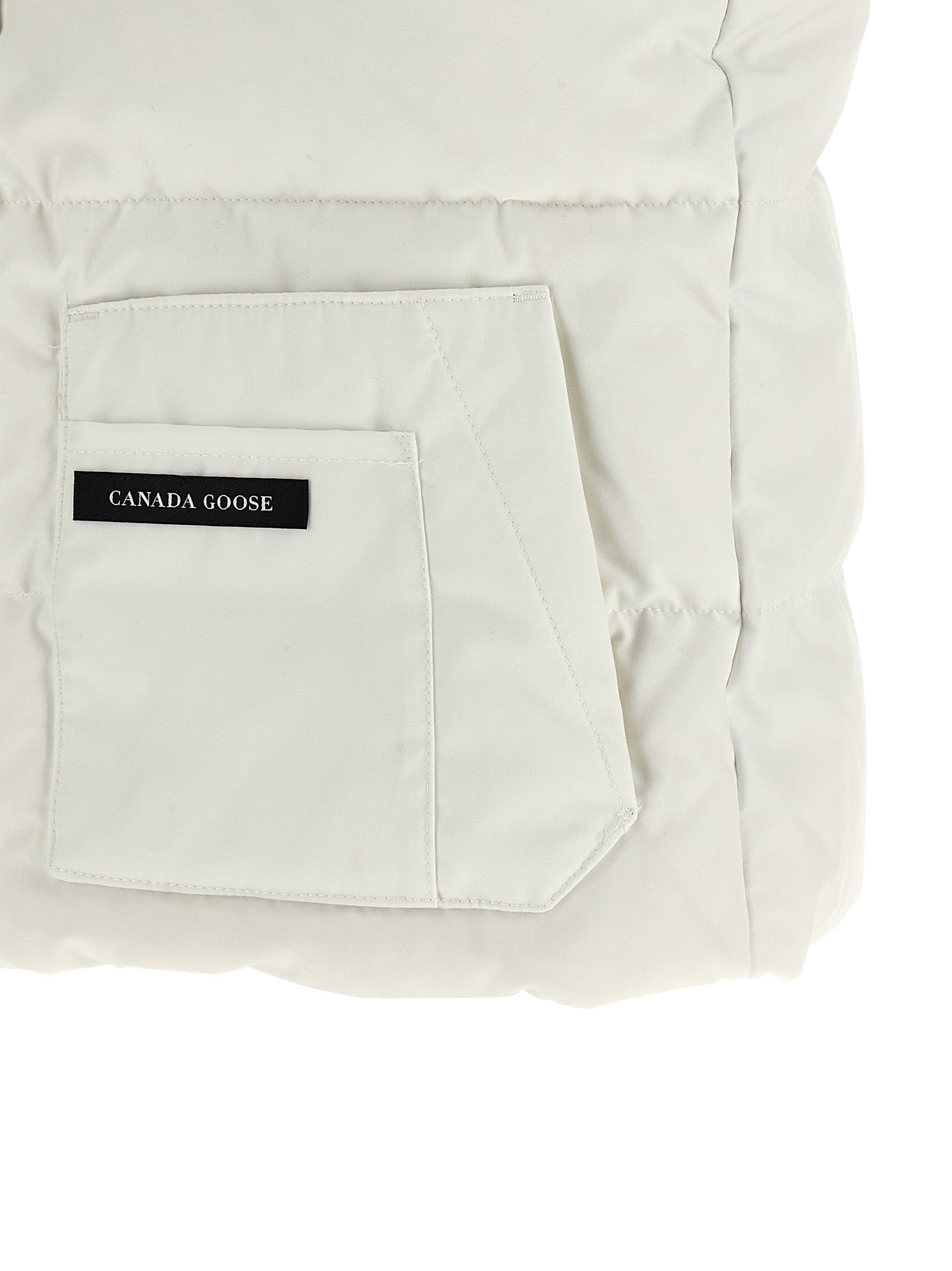 Vest by Canada Goose for women in cotton polyester black & white features an contemporary silhouette, showcasing refined pockets and a contemporary for a sophisticated layered look.