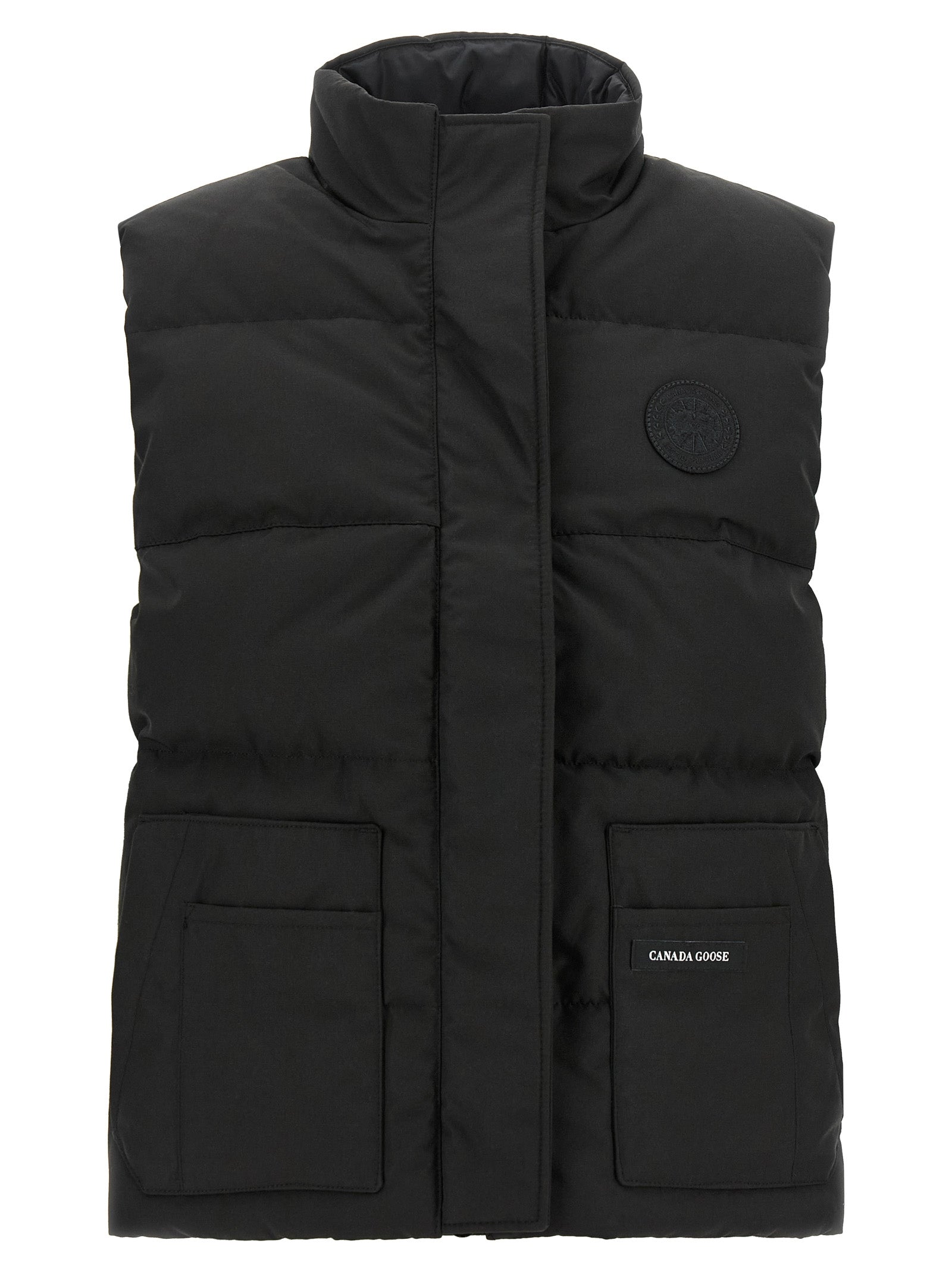 Vest by Canada Goose for women in cotton polyester black features a chic silhouette, expertly detailed with a refined high-neck neckline and premium thermal & pockets for a truly chic look.