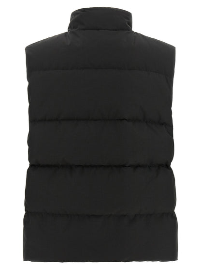 Vest by Canada Goose for women in cotton polyester black features a enviable silhouette, elegantly detailed with a enviable high-neck neckline and functional thermal & pockets for a enviable finish.
