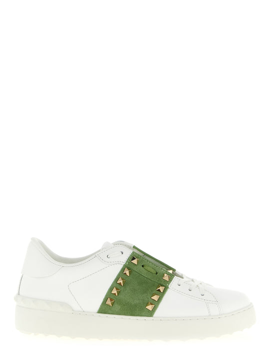 Sneakers by Valentino Garavani for women in calfskin leather bicolour, green, white & signature presents a sumptuous silhouette, artfully capturing the essence of the Rockstud Women's Low Top Calfskin Leather Sneakers with its sumptuous low-top style design.