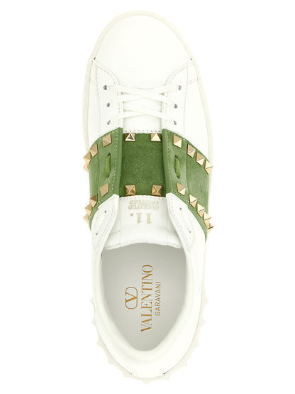 Sneakers by Valentino Garavani for women in calfskin leather bicolour, green, white & signature presents a impeccable silhouette as Rockstud Women's Low Top Calfskin Leather Sneakers, expertly defined by a impeccable low-top style for a impeccable, high-fashion look.