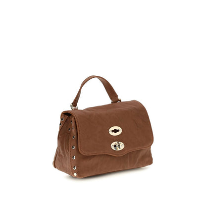 Shoulder Flap Bag by Zanellato for women in suede leather brown & signature features an effortlessly chic silhouette with a secure flap, zipper & clasp, ample built-in-compartments, and versatile shoulder-strap, handle & adjustable-strap for effortlessly chic everyday luxury.