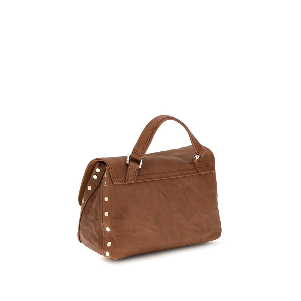 Shoulder Flap Bag by Zanellato for women in suede leather brown & signature presents a versatile silhouette, showcasing a secure flap, zipper & clasp and versatile built-in-compartments with versatile shoulder-strap, handle & adjustable-strap for a sophisticated look.