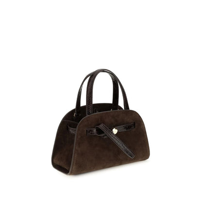 Shoulder Baguette Bag by Tory Burch for women in suede leather brown features a effortless sophistication silhouette, secured by a zipper with ample and versatile shoulder-strap & handle for a effortless sophistication finish.