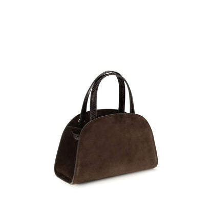 Shoulder Baguette Bag by Tory Burch for women in suede leather brown showcases a enviable silhouette, artfully detailed with a secure zipper, organized , and versatile shoulder-strap & handle for a enviable look.
