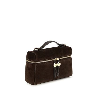 Compact Shoulder Bag by Tory Burch for women in suede leather brown showcases a enviable silhouette, artfully detailed with a secure zipper, organized , and versatile shoulder-strap & handle for a enviable look.