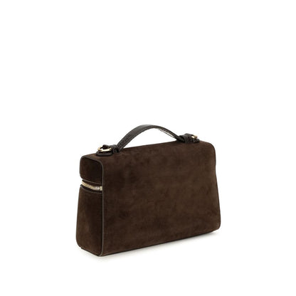 Compact Shoulder Bag by Tory Burch for women in suede leather brown features a effortless sophistication silhouette, secured by a zipper with ample and versatile shoulder-strap & handle for a effortless sophistication finish.