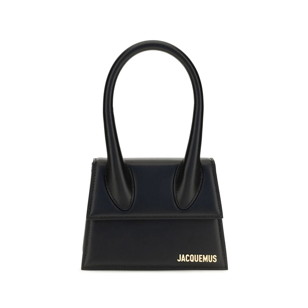 Compact Flap Handbag by Jacquemus for women in bos taurus calf leather black & gold features a contemporary silhouette, showcasing a secure flap & magnetic, ample , and contemporary shoulder-strap & handle for a sophisticated look.
