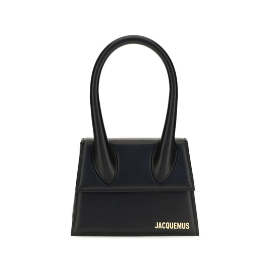 Compact Flap Handbag by Jacquemus for women in bos taurus calf leather black & gold features a contemporary silhouette, showcasing a secure flap & magnetic, ample , and contemporary shoulder-strap & handle for a sophisticated look.
