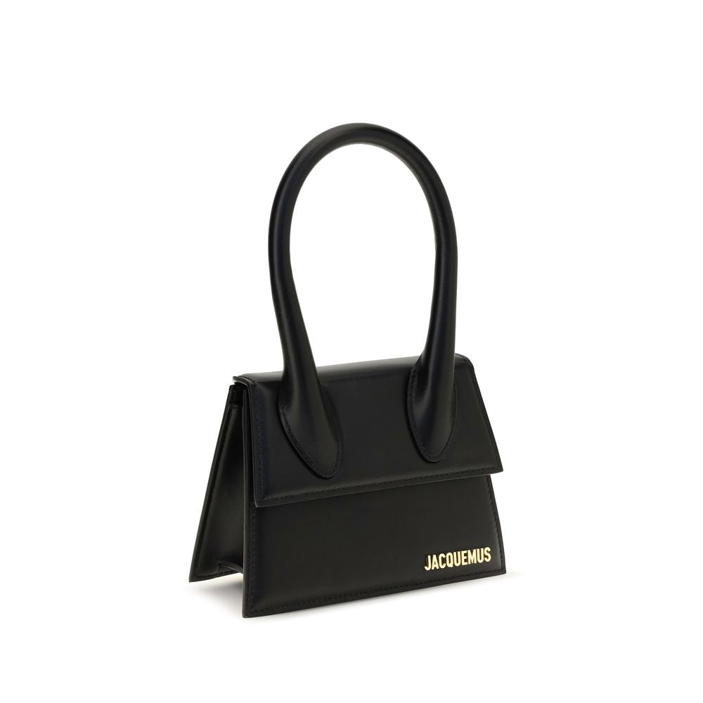 Compact Flap Handbag by Jacquemus for women in bos taurus calf leather black & gold features a signature silhouette, showcasing a secure flap & magnetic and signature with versatile shoulder-strap & handle for a sophisticated look.