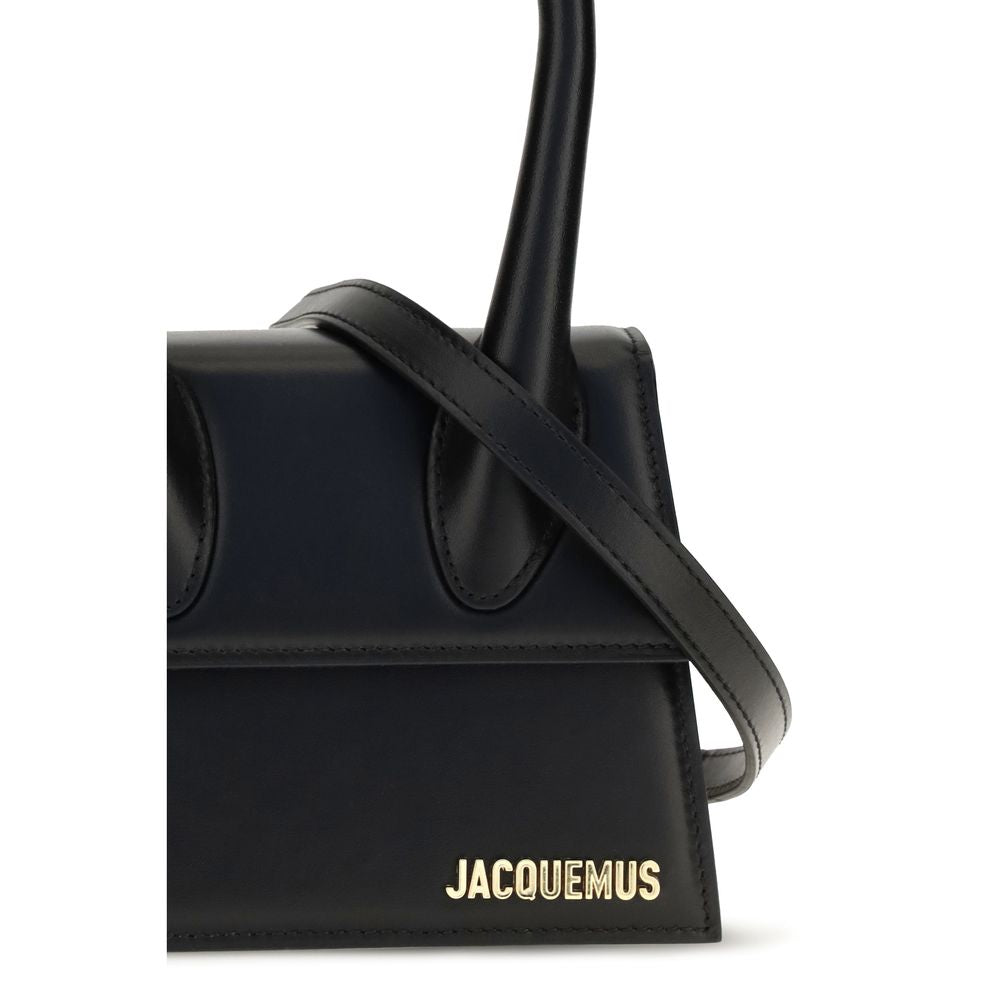 Compact Flap Handbag by Jacquemus for women in bos taurus calf leather black & gold features a refined silhouette, showcasing a secure flap & magnetic, organized , and versatile shoulder-strap & handle for a refined finish.