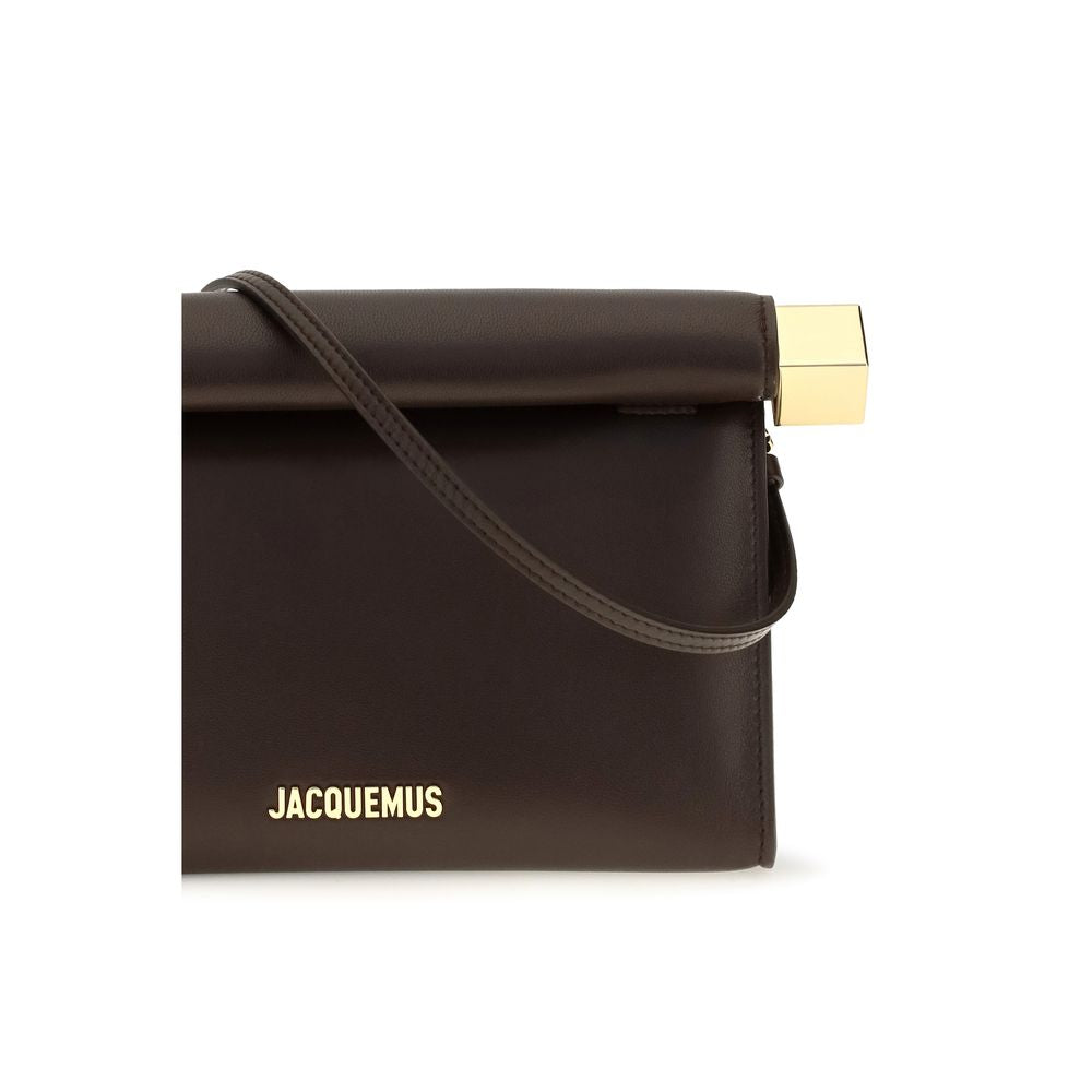 Shoulder Flap Clutch Handbag by Jacquemus for women in nappa leather & cotton brown & gold showcases a sculptural silhouette, featuring a secure flap, zipper & magnetic, ample , and versatile shoulder-strap & handle for a sculptural aesthetic.